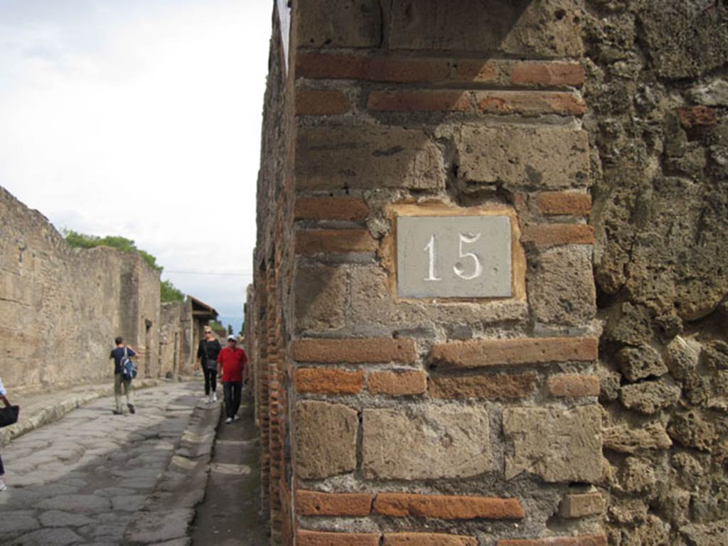 I.3.15 Pompeii. September 2010. ID number plate, looking east along Vicolo del Menandro. 
Photo courtesy of Drew Baker.
