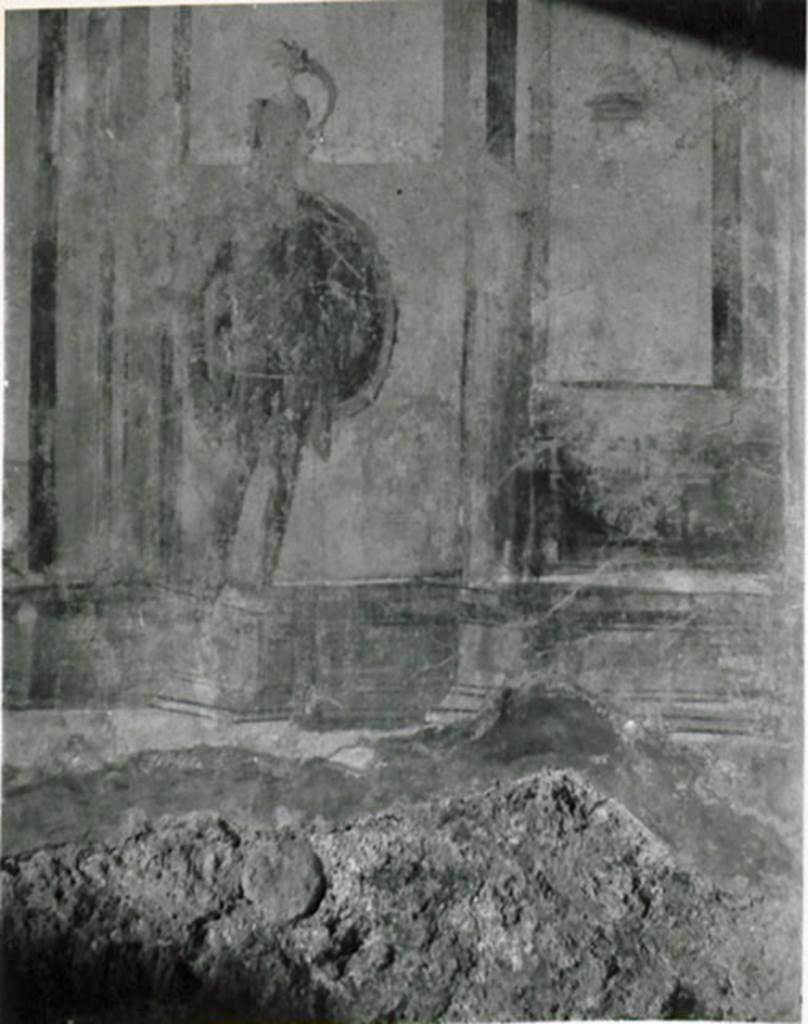 I.3.25 Pompeii. 1935 photograph taken by Tatiana Warscher. Oecus east wall. Figure at the south end of the east wall, stolen in 1977. According to Warscher, unfortunately she could not photograph the walls of the oecus because of the dimness of the light. She was limited to photograph only the first figure on the east wall. Warscher called this room a triclinium, although she acknowledged that Fiorelli described it as an oecus.
See Warscher, T, 1935: Codex Topographicus Pompejanus, Regio I, 3: (no.69), Rome, DAIR, whose copyright it remains.  
