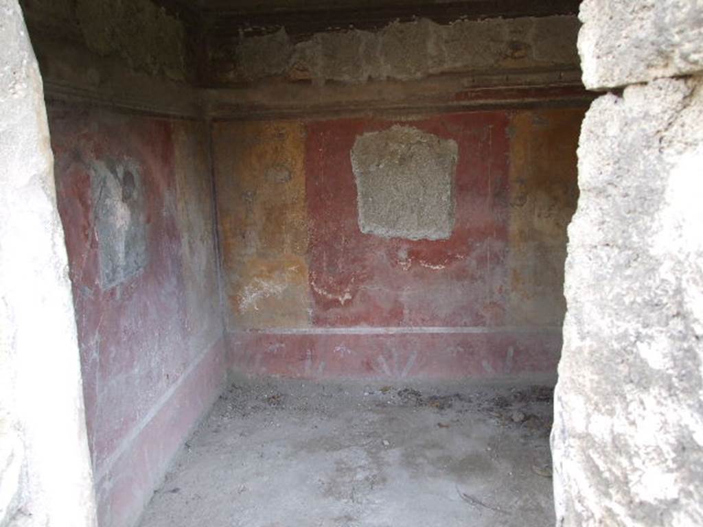 I.3.25 Pompeii. December 2006. Doorway to cubiculum on south side of peristyle, looking towards south-east corner. According to Trendelenburg, the colours of the surviving two paintings in this room were very faded. The details from the paintings could not be seen with certainty. However, the painting to the left of the doorway, on the east wall, represented Andromeda being liberated by Perseus. In the painting on the south wall, could be seen a young sitting man (perhaps Narcissus? - but according to Sogliano this was Ciparisso - See Sogliano, A., 1879. Le pitture murali campane scoverte negli anni 1867-79. Napoli: Giannini, p.28, no.109). The painting on the door (north) wall was destroyed, and the one on the west wall was replaced by a window. See Trendelenburg in BdI, 1871, (p.174-5)
