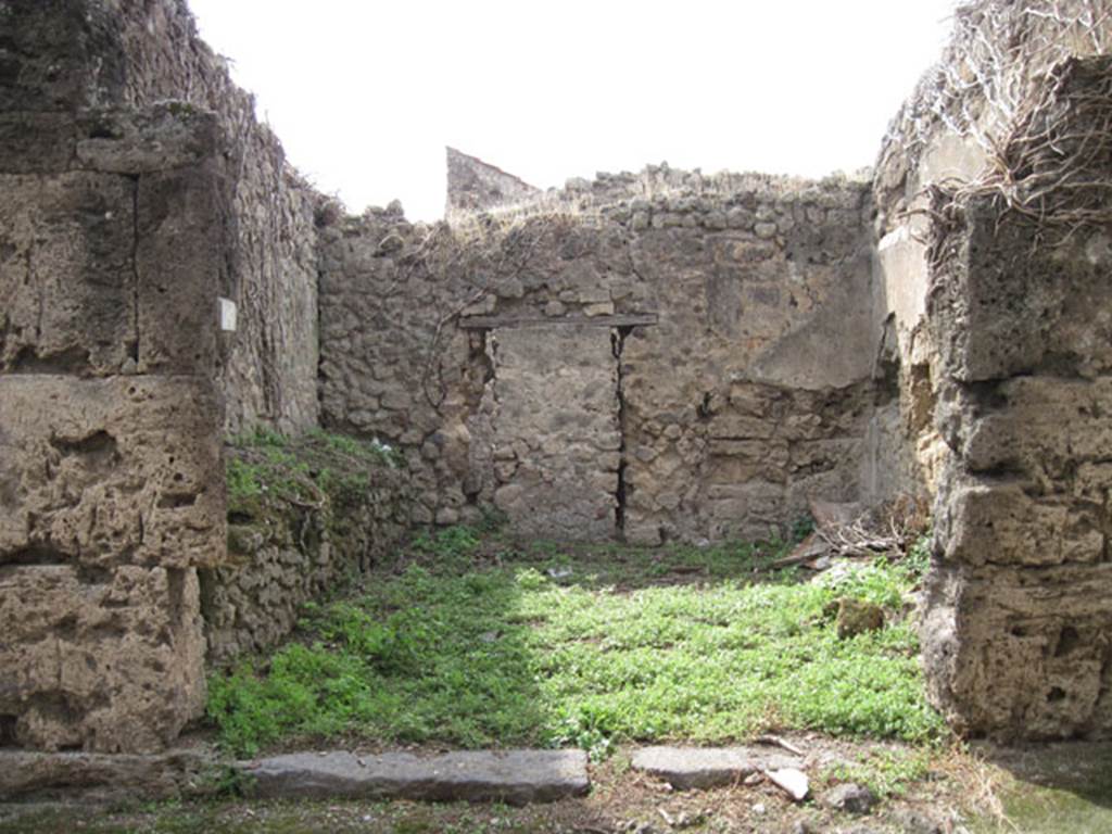 I.3.26 Pompeii. September 2010. Looking west towards entrance from Vicolo del Citarista, (note blocked door). Photo courtesy of Drew Baker. According to Warscher, this was a shop with a high podium against the wall on the left side of the entrance doorway. In the rear wall was a doorway (now blocked) leading to a rear room linked to the atrium of I.3.25.
See Warscher, T, 1935: Codex Topographicus Pompejanus, Regio I, 3: DAI, Rome.  

