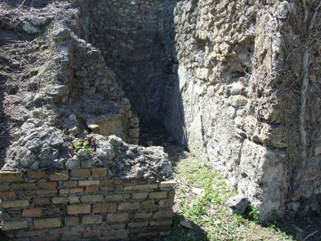 I.3.30 Pompeii. March 2009.  Site of remains of lararium in west wall of peristyle, and doorway to room 3, the well room. At the rear of the well room, another small room can be seen.
