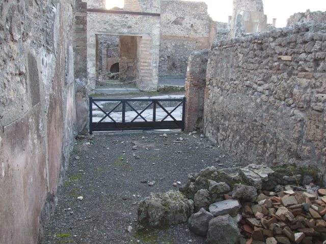 I.4.6 Pompeii. December 2007. South wall of shop, with site of stairs to upper floor visible in the plasterwork.