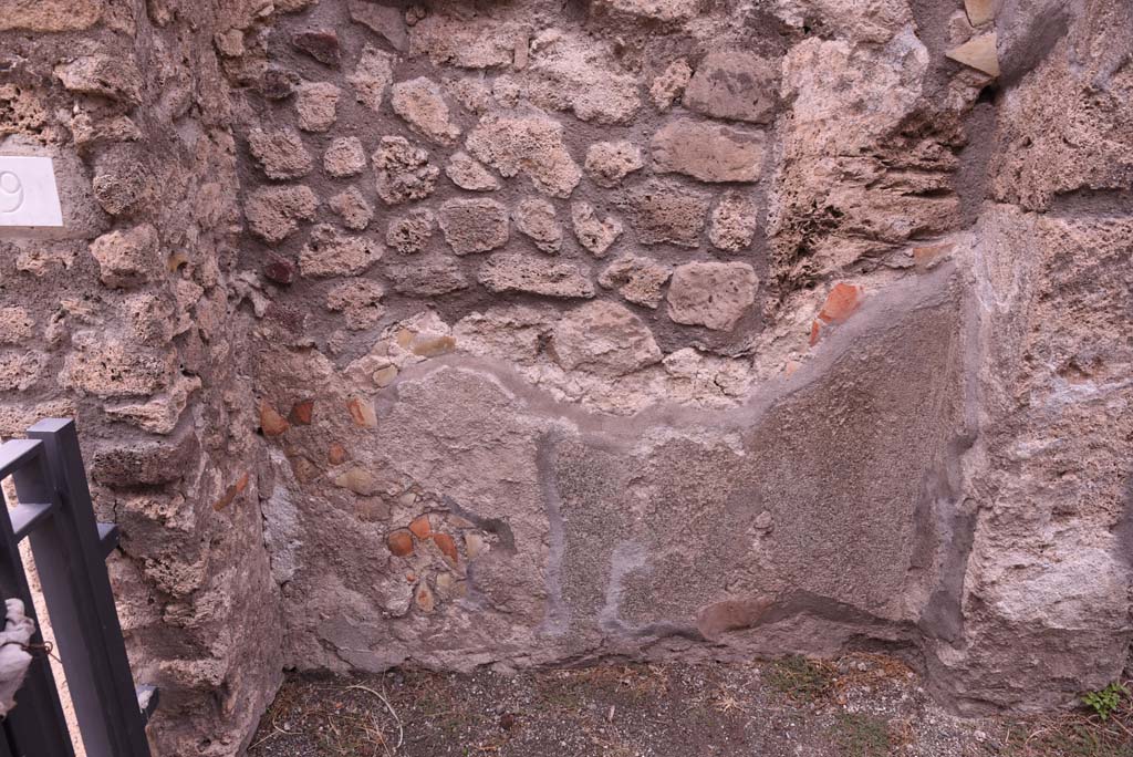 I.4.9 Pompeii. July 2008. Downpipe on north wall of entrance corridor or fauces. Photo courtesy of Barry Hobson.