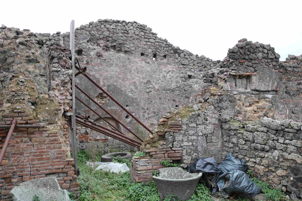 I.4.12 Pompeii. December 2018. Looking south through doorway to room on west side of oven. Photo courtesy of Aude Durand.