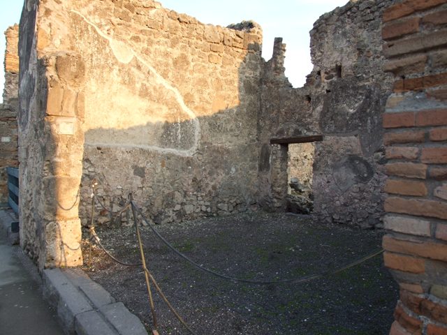 I.4.17 Pompeii. December 2007. West wall with doorway looking west across I.4.16 to I.4.15.