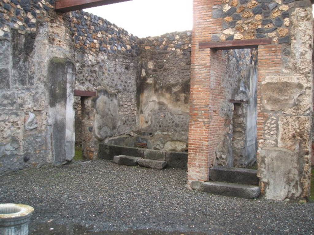 I.4.25 Pompeii. December 2004. Atrium 47, looking west to west ala 51, and doorway with stairs above room 50.