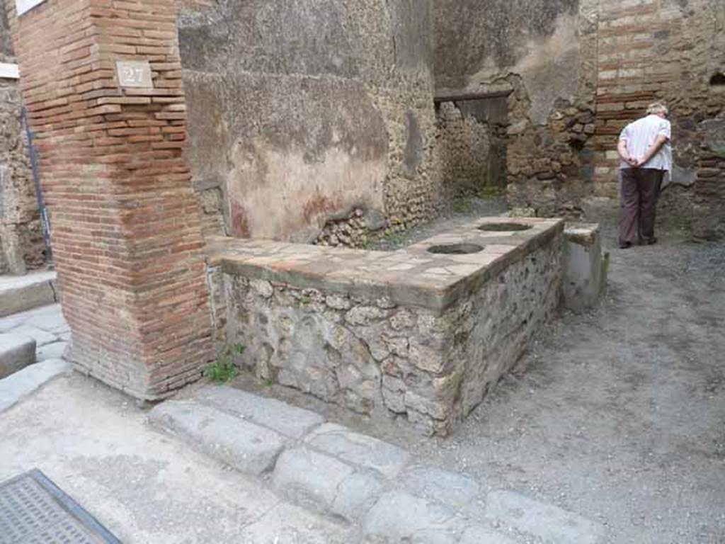 I.4.27 Pompeii. December 2007. Rear of counter with hearth.