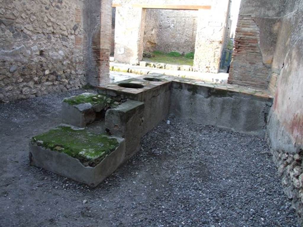 I.4.27 Pompeii. May 2010. Looking south to doorway to rear room.