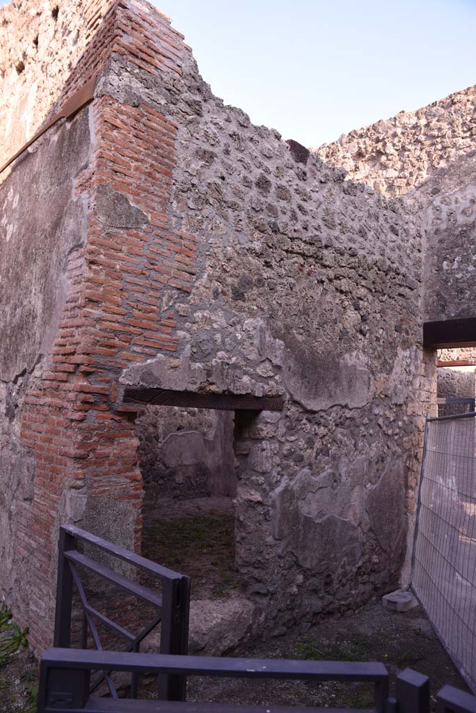 I.4.28 Pompeii. December 2007. North wall of atrium, looking north at doorway to room 5, stables.  