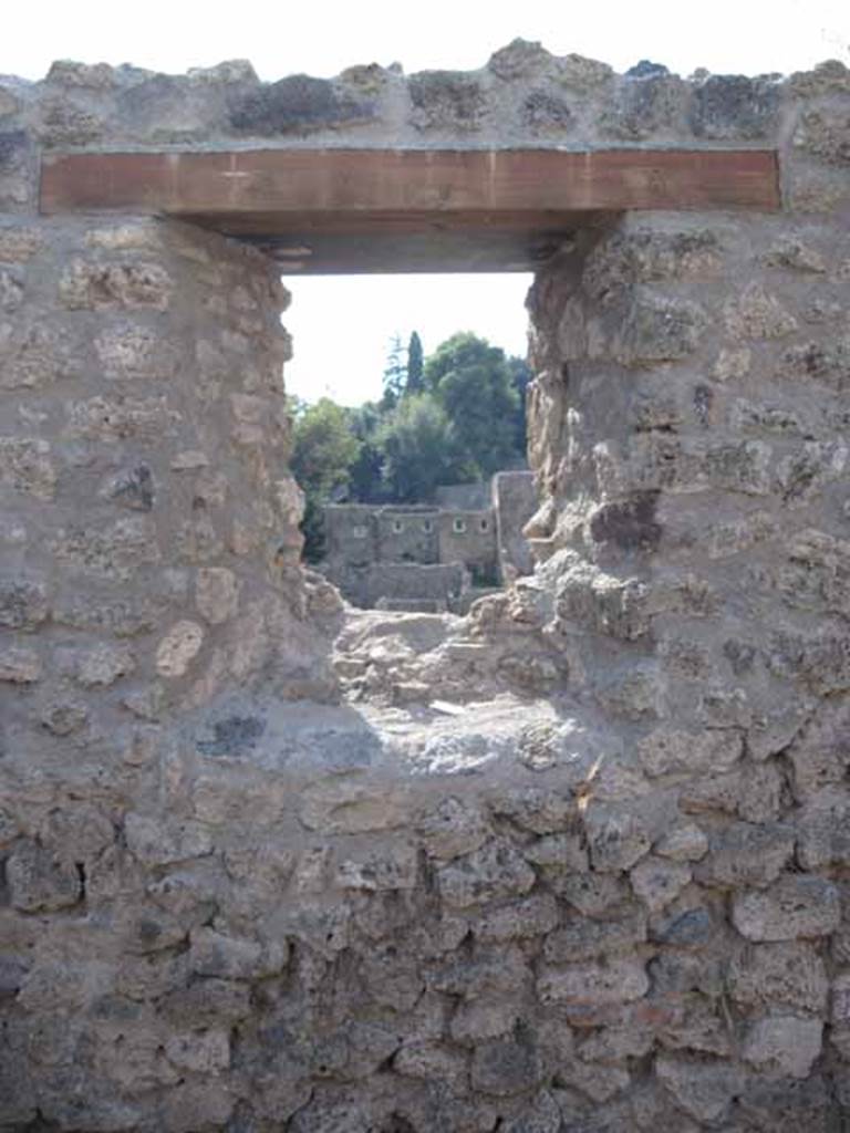 I.5.1 Pompeii. September 2010. Looking west from window in rear room, looking onto unnamed vicolo and west towards Via Stabiana. Photo courtesy of Drew Baker.

