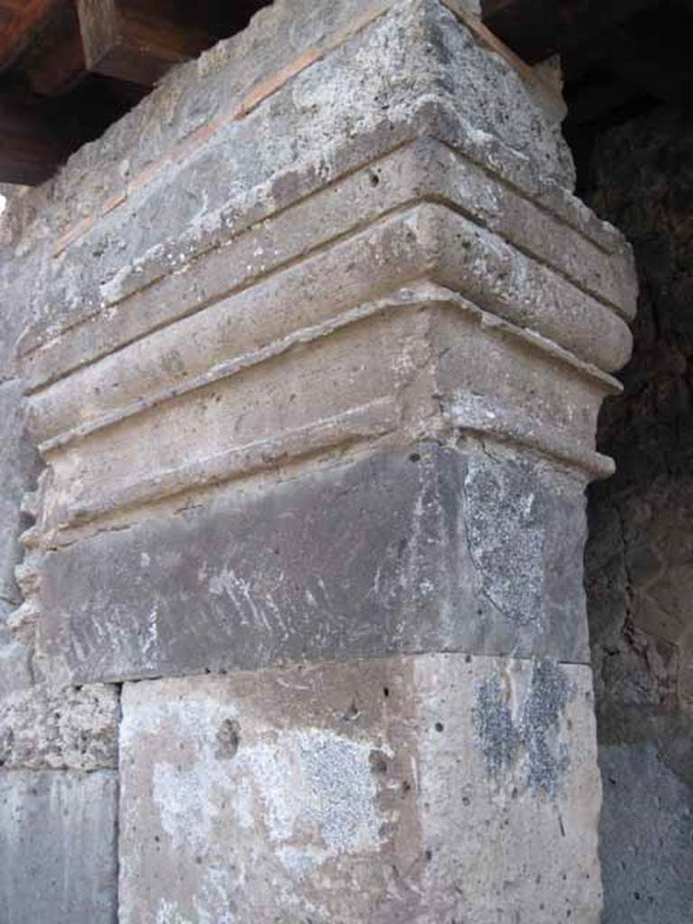 I.5.1 Pompeii. September 2005. Detail of portico or structure on east side, in roadway between I.5.1 and I.5.2. Looking south. 
