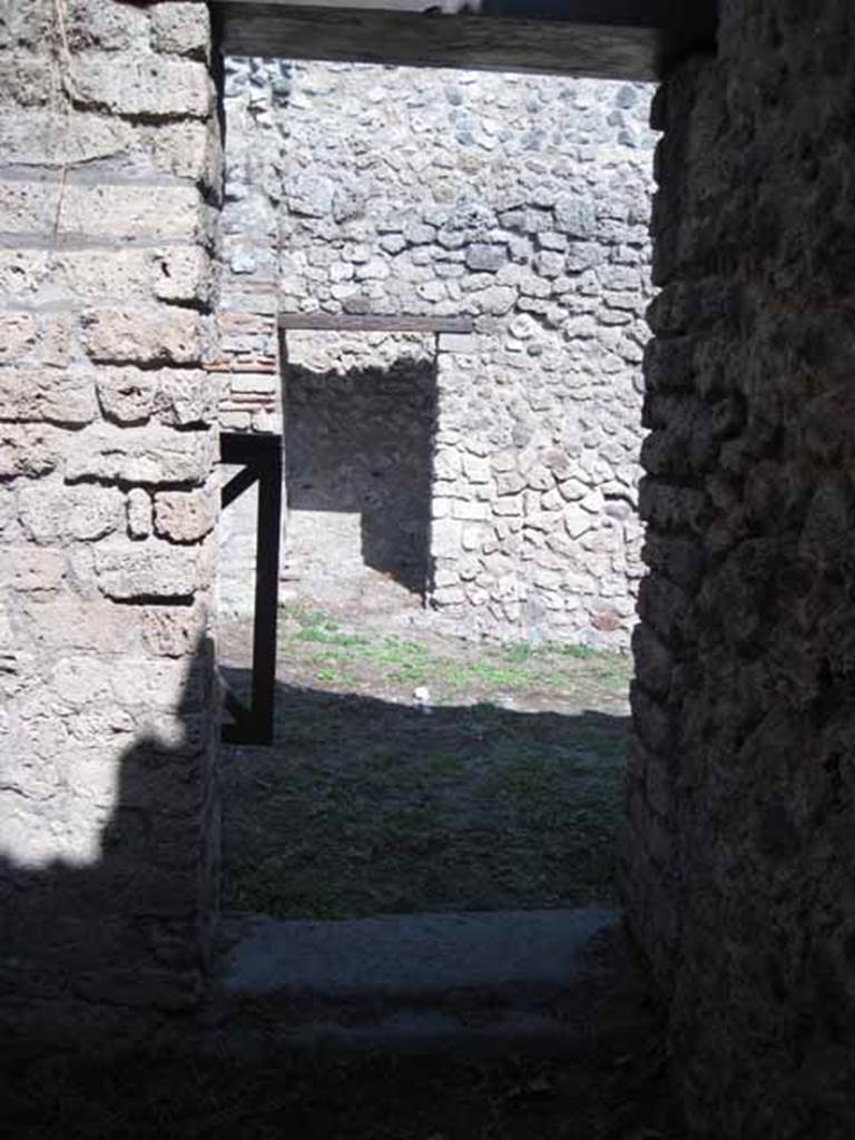 I.5.2 Pompeii. September 2010. Antechamber showing doorway to peristyle area with triclinium, looking south. Photo courtesy of Drew Baker.

