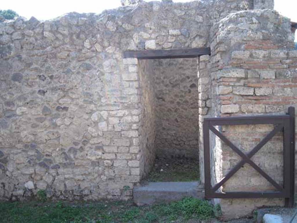 I.5.2 Pompeii. September 2010. Doorway to room on west side of shop-room. Photo courtesy of Drew Baker.
