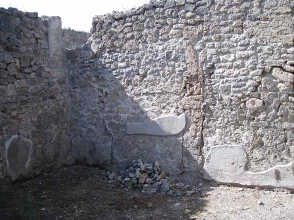 I.5.2 Pompeii. September 2010. Looking at north wall of room in north-west corner of peristyle.  Photo courtesy of Drew Baker.

