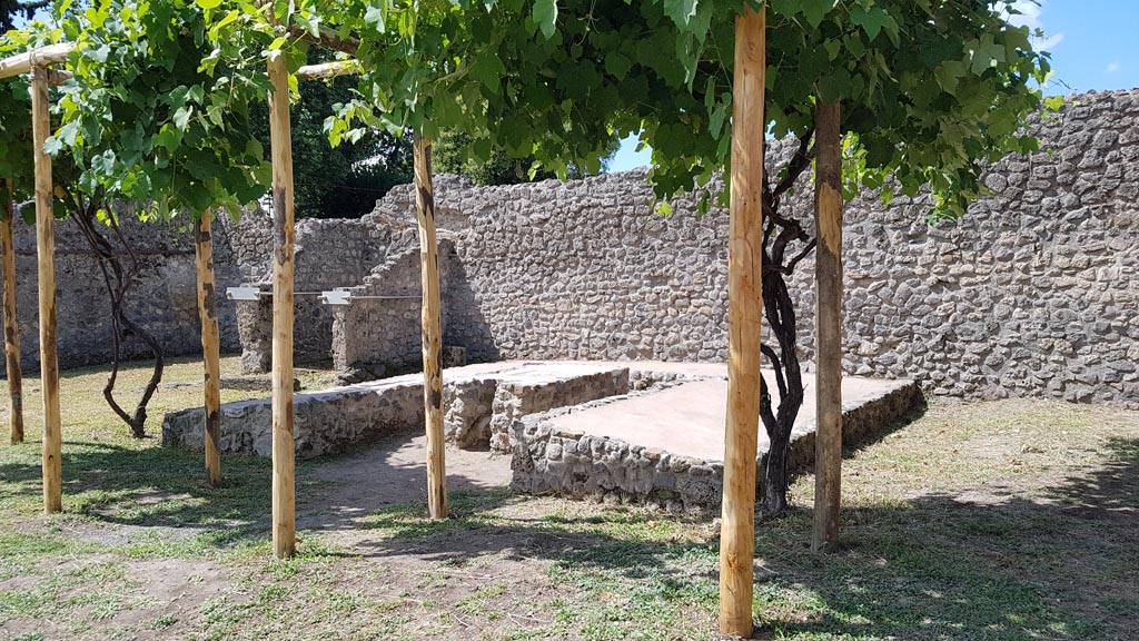 I.5.2 Pompeii. August 2023. Looking south-west towards triclinium. Photo courtesy of Maribel Velasco.