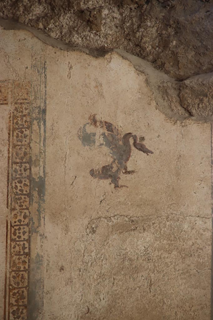 I.6.4 Pompeii. October 2022. 
Room 17, detail from upper west end of north wall. Photo courtesy of Klaus Heese. 

