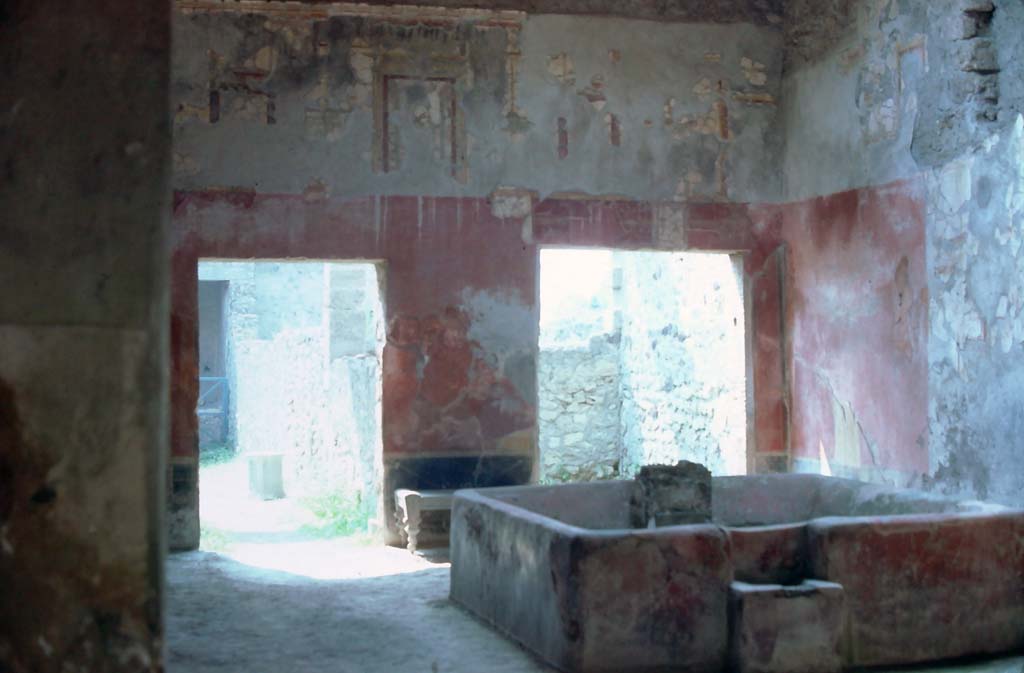 I.6.7, Pompeii, 7th August 1976. Atrium, looking towards south wall and south-west corner.
Photo courtesy of Rick Bauer, from Dr George Fays slides collection.

