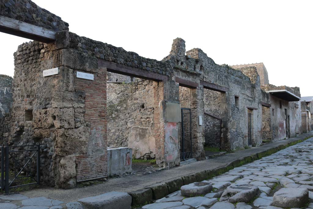 I.7.8 to I.7.1, Pompeii. December 2018. Entrance doorways on south side of Via dell’Abbondanza. Photo courtesy of Aude Durand.