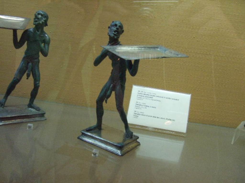 Bronze statues found in I.7.10-12.  Now in Naples Archaeological Museum