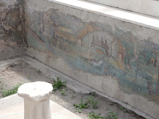 I.7.12 Pompeii. May 2017. Painted panel on inside of west side of summer triclinium.  Photo courtesy of Buzz Ferebee.

