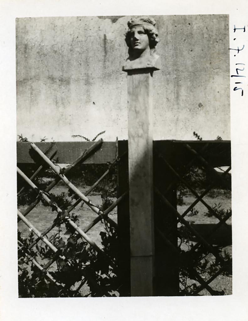 I.7.10/12, Pompeii, but shown as I.7.12/15 on photo. Pre-1937-39. Garden decoration.
Photo courtesy of American Academy in Rome, Photographic Archive.  Warsher collection no. 1893.
This head was of a female herm from the garden area made of yellow marble (height 0.145m).
See Maiuri, A., 1928. Nuovi Scavi nella Via dell’Abbondanza. Milano: Hoepli. (p.74, fig.39).
