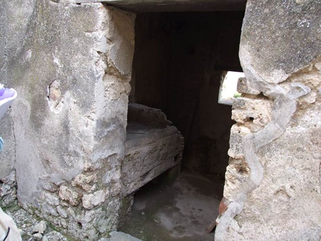 I.7.12 Pompeii. December 2006. Doorway to kitchen and latrine on south side of entrance doorway.