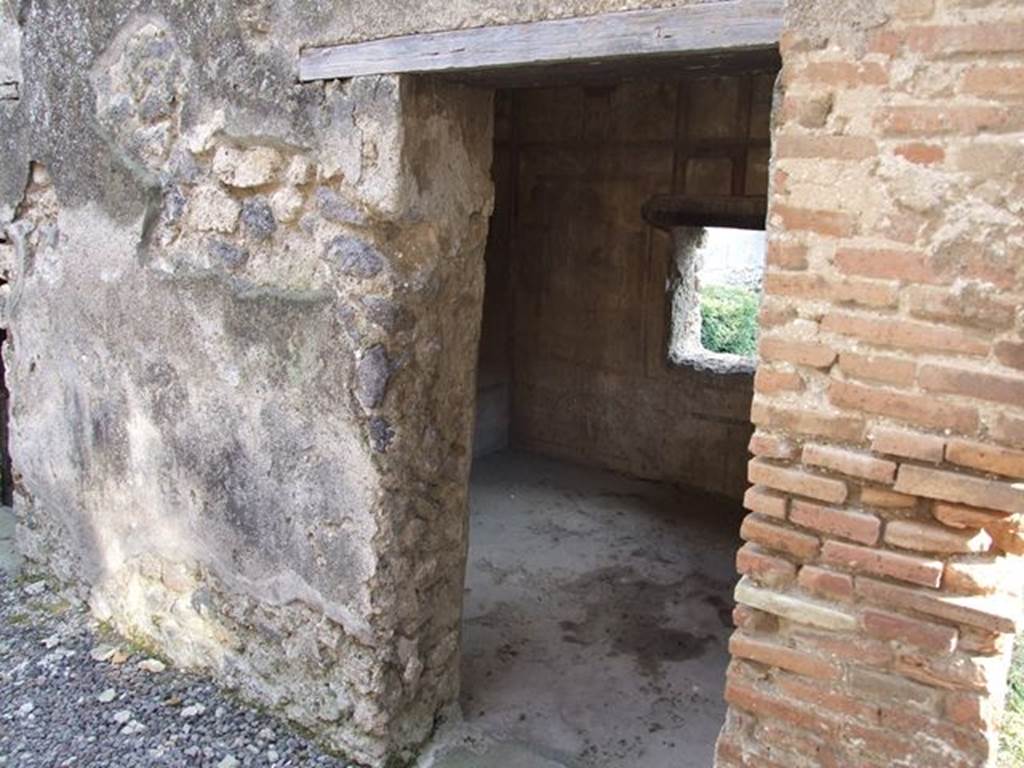 I.7.12 Pompeii. December 2006. Looking south into doorway to cubiculum, on west side of kitchen.
