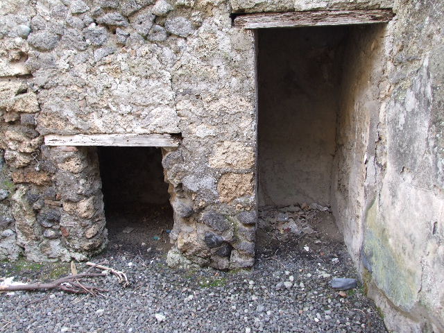 I.7.19 Pompeii. December 2006.Two small cupboards under the stairs in room in north-west corner of atrium. 
