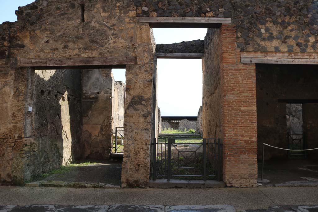 I.8.2 Pompeii. December 2018. Entrance doorway, in centre, on south side of Via dell’Abbondanza. Photo courtesy of Aude Durand.