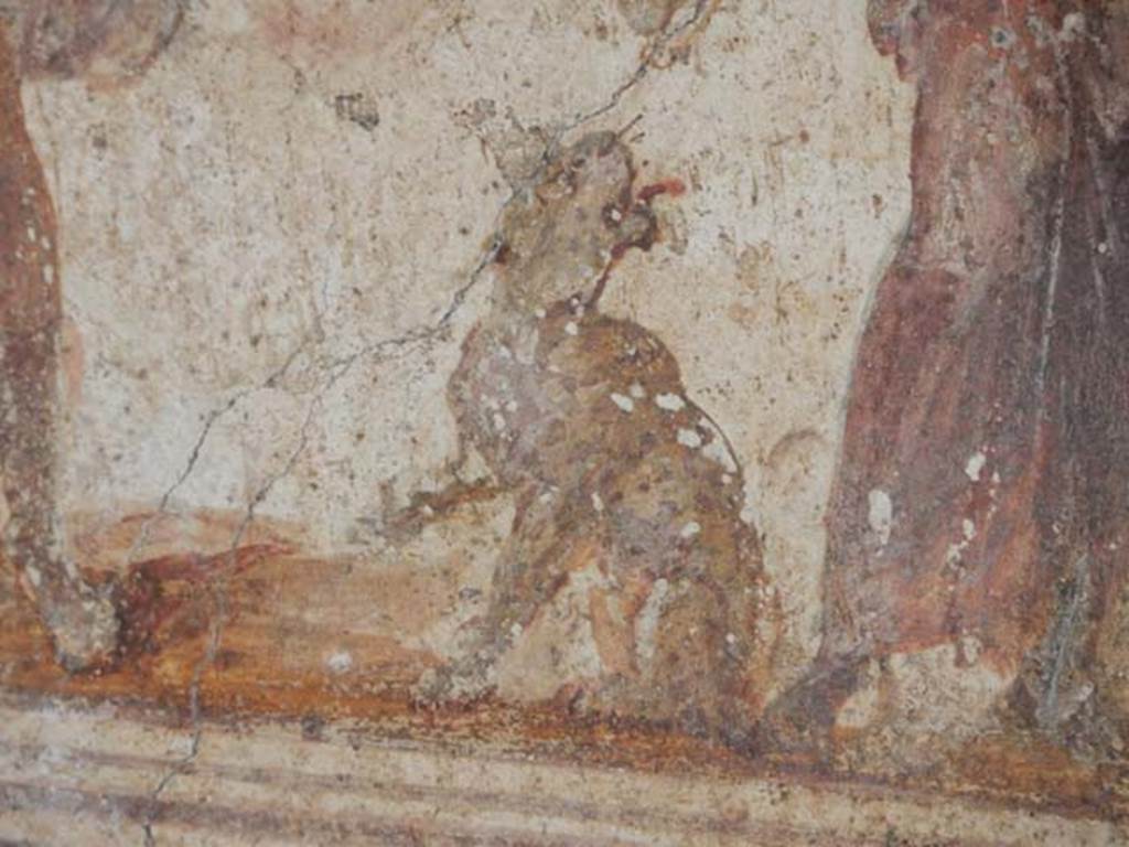 I.8.8 Pompeii. December 2018. Detail from below lararium on south wall with two serpents approaching a round altar. Photo courtesy of Aude Durand.

