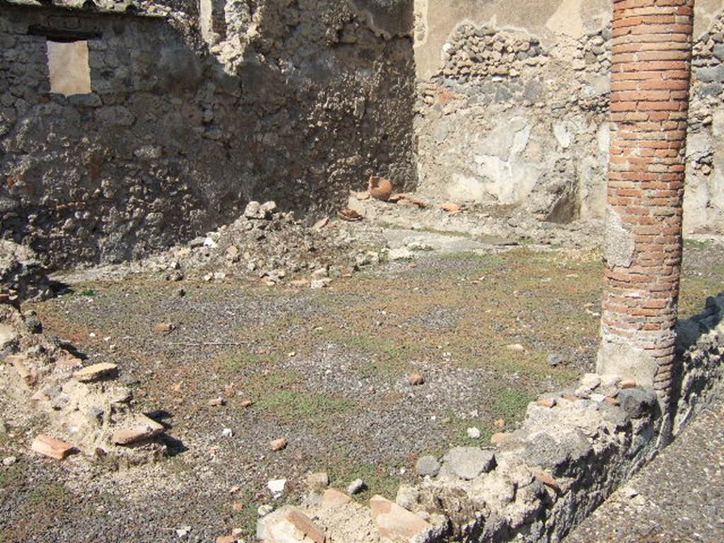I.8.10 Pompeii. Lararium shortly after excavation.
In the middle of the uppermost zone is the niche, where poppies with purple flowers are painted on the back wall.
There were two Lares, one on either side of the niche.
There were two serpents, one rising either side of a round altar.  
The horizontal line, on which the base of a round altar rested, was about halfway up the serpent’s body.
The background of the middle zone is formed by oleander-like plants.
The lowest zone is filled by two perennial plants, probably lilies.
See Fröhlich, T., 1991. Lararien und Fassadenbilder in den Vesuvstädten. Mainz: von Zabern. (L9: p.253, T25.2).
