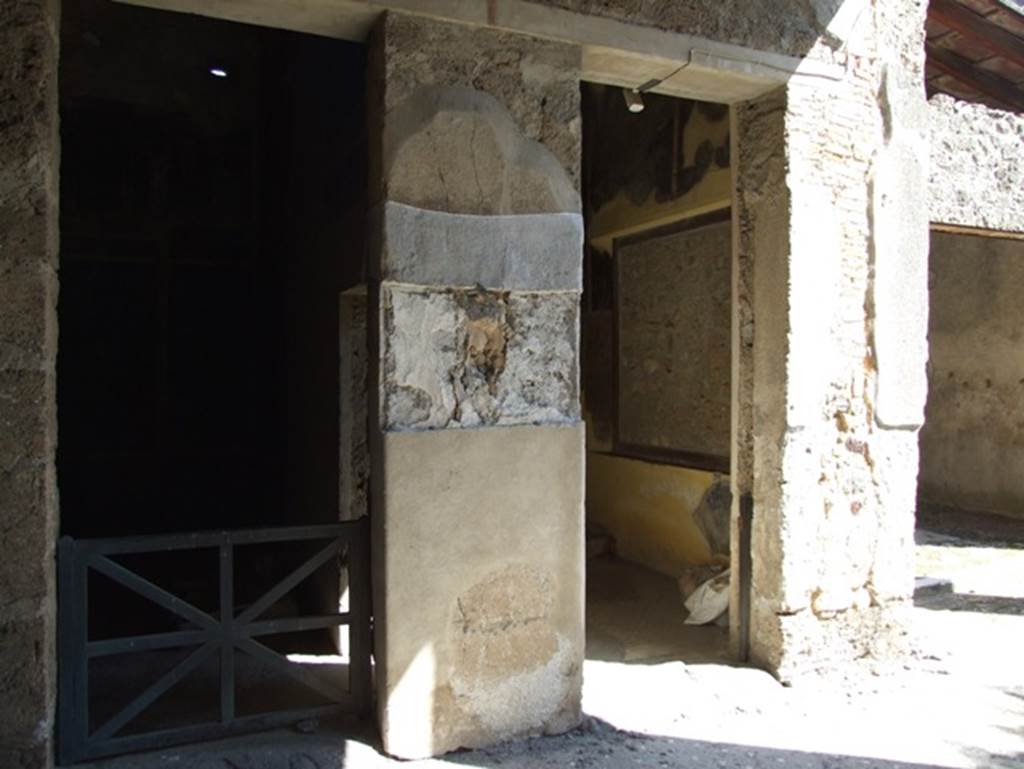 I.9.5 Pompeii. March 2009. Room 10, room 11 and doorway to room 13. 
Looking east from rear of tablinum.
Between the doorways to rooms 10 and 11, a rectangular “mirror” of black obsidian was found above the high white zoccolo.
Graffiti was scratched into the plaster surrounding the mirror.
CIL IV, 10004, 10005, 10006, 10007 were found here.
According to Epigraphik-Datenbank Clauss/Slaby (See www.manfredclauss.de) these read

Eupl(i)a laxa landicosa       [CIL IV, 10004]
Fortunata                              [CIL IV, 10005]
Cindeus i()                            [CIL IV, 10006] 
P(ubli) Petroni Saturnini      [CIL IV, 10007]
