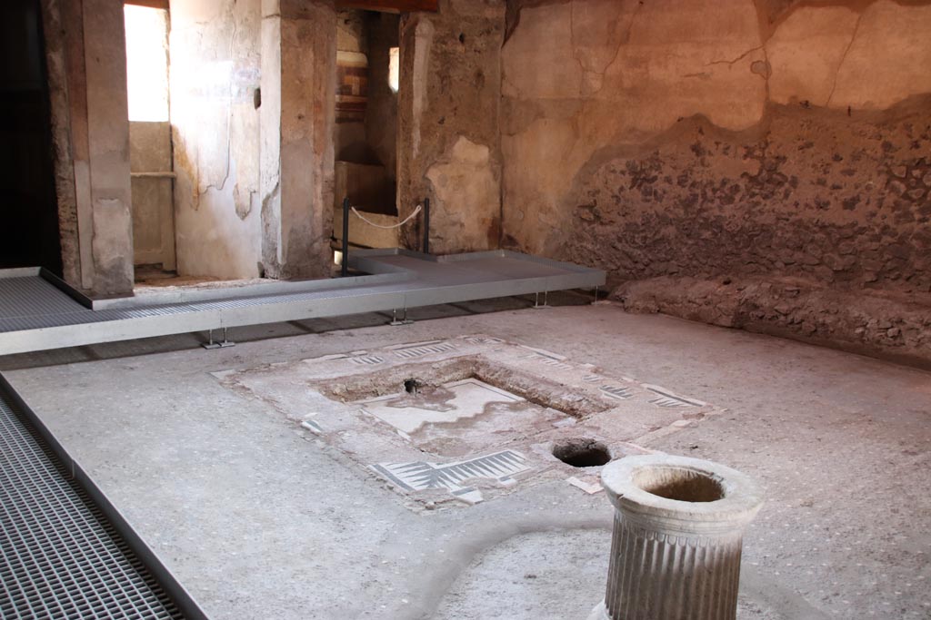 I.9.14 Pompeii. October 2022. Room 8, looking south-west across impluvium in atrium.  Photo courtesy of Klaus Heese.