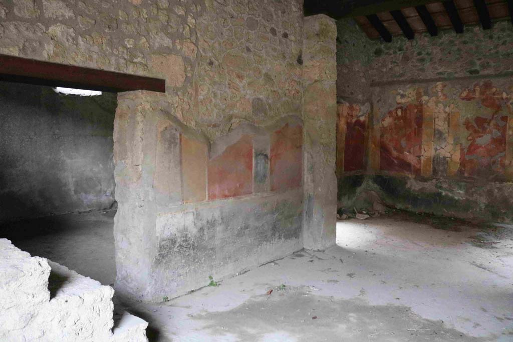 I.10.1 Pompeii. December 2018. 
Looking towards east wall of atrium with doorway to oecus and steps to upper floor, on left. On the right would be a doorway to a cubiculum.
Photo courtesy of Aude Durand.
