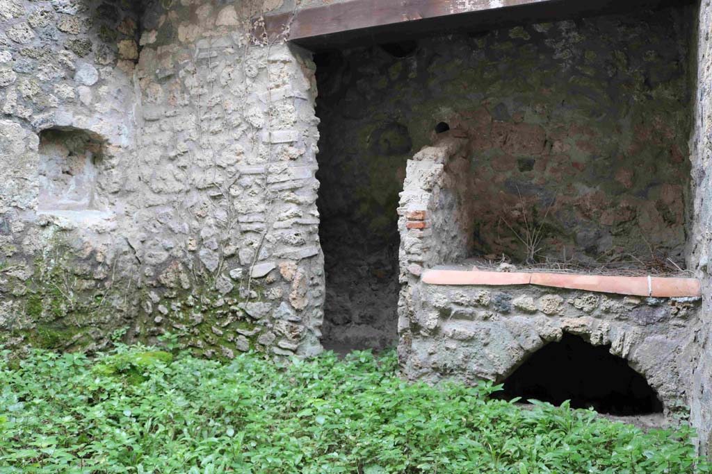 I.10.1 Pompeii. December 2018. West wall of small uncovered area, with large doorway to kitchen area. Photo courtesy of Aude Durand.