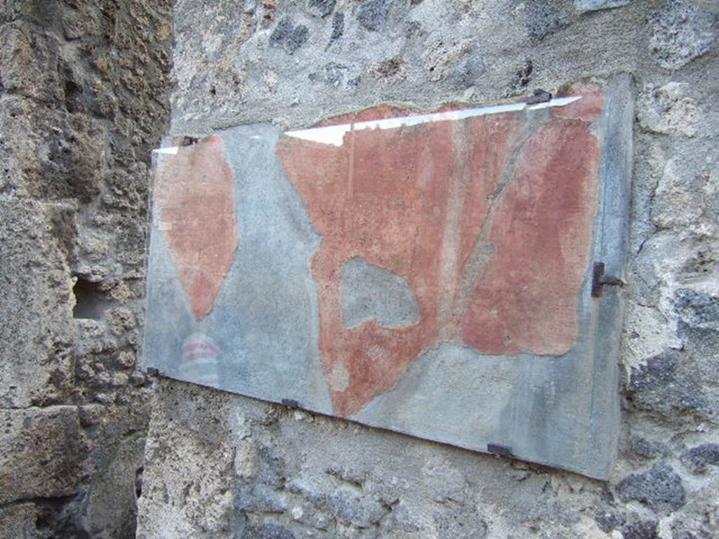 I.10.3 Pompeii.  December 2006.  Painted plaster on west side of entrance.