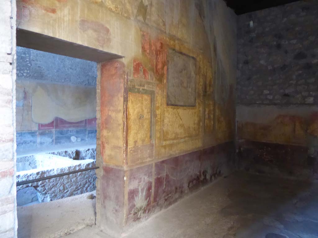 I.10.4 Pompeii. April 2019. Room 19, north wall with doorway to room 18. 
Photo courtesy of Rick Bauer.
