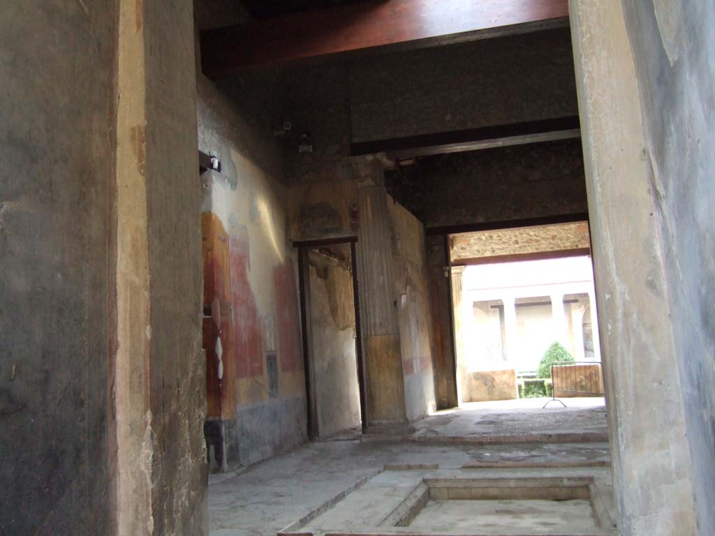 I.10.4 Pompeii. December 2005. Looking towards the south-east corner of the atrium showing corridor 9 and room 8.