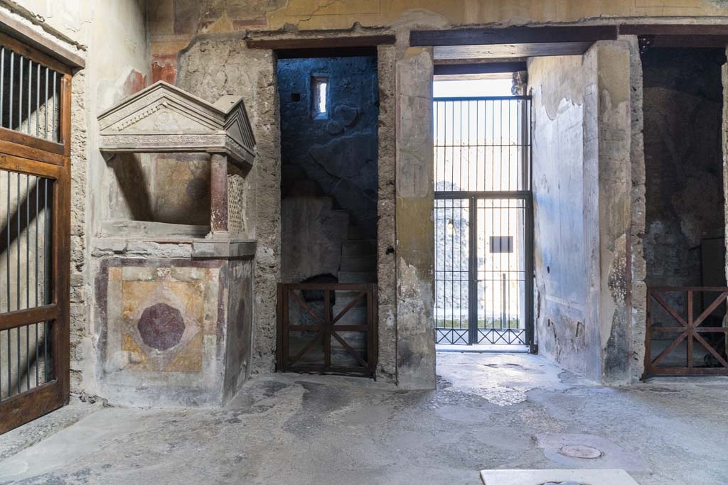 I.10.4 Pompeii. April 2022. Looking towards the lararium in north-west corner of atrium. Photo courtesy of Johannes Eber.