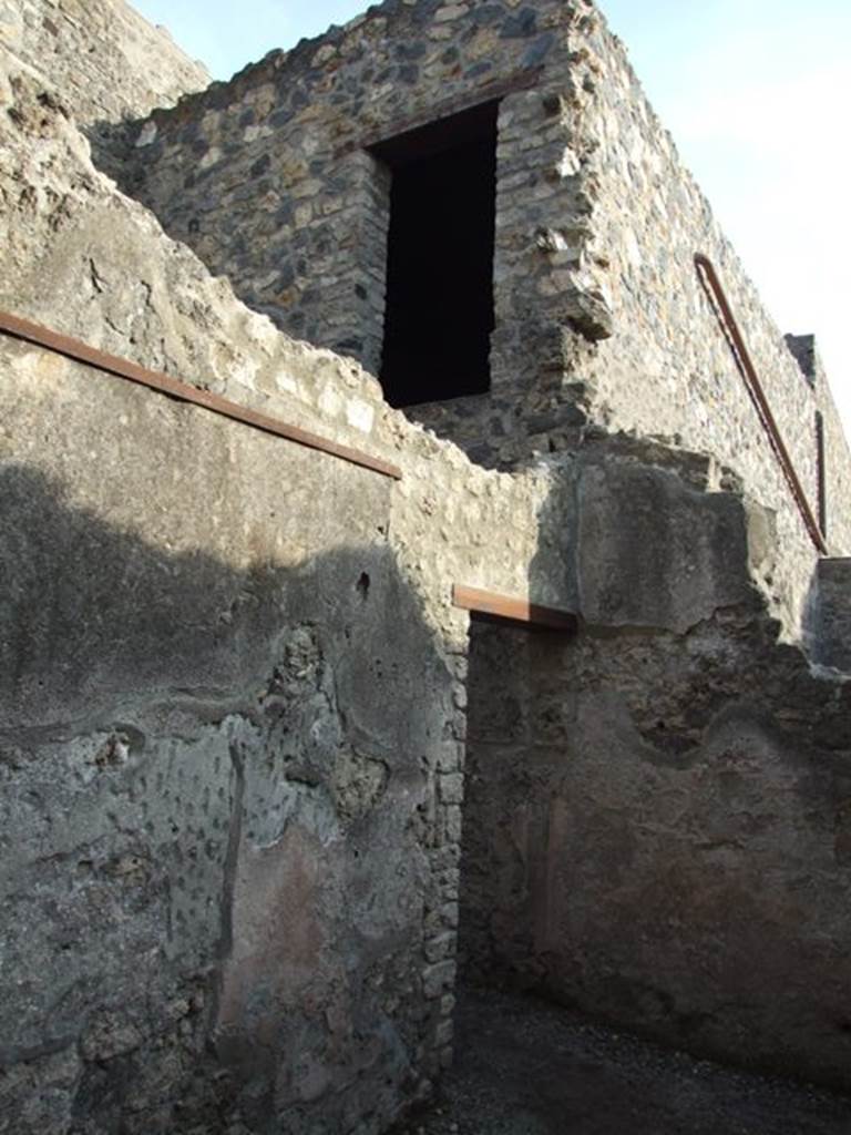 I.10.6 Pompeii. December 2007.  Doorway in east wall of workshop and doorway on floor above. 
