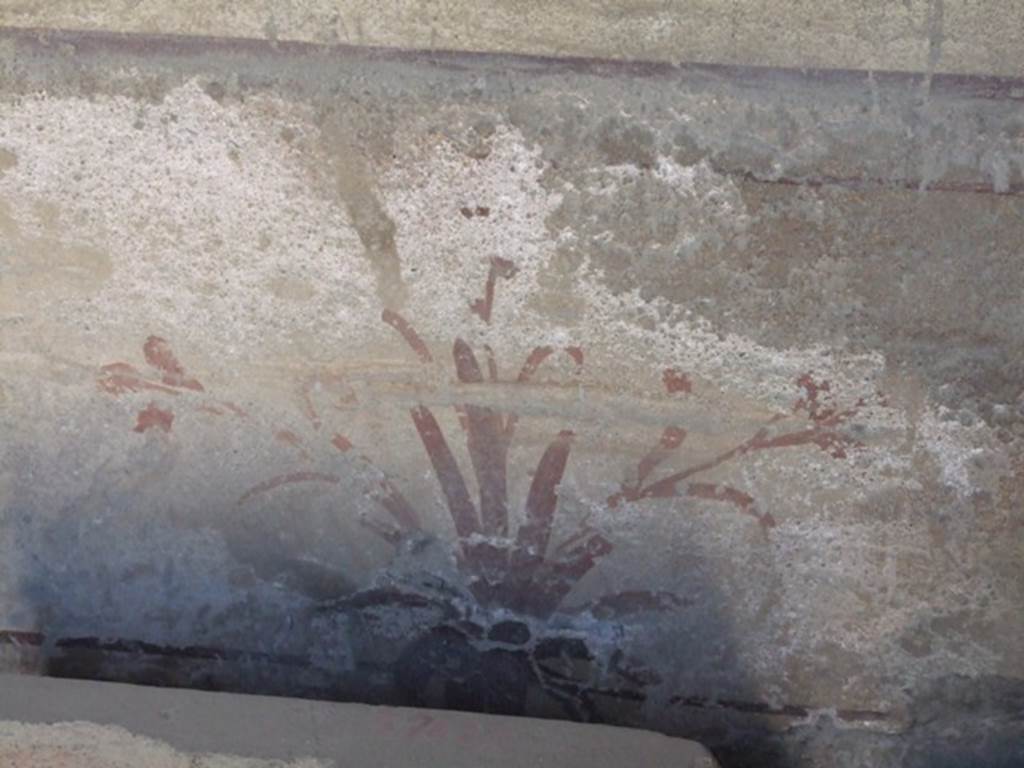 I.10.7 Pompeii. March 2009.  Room 3, painting of plant on lower section of west wall of cubiculum.
