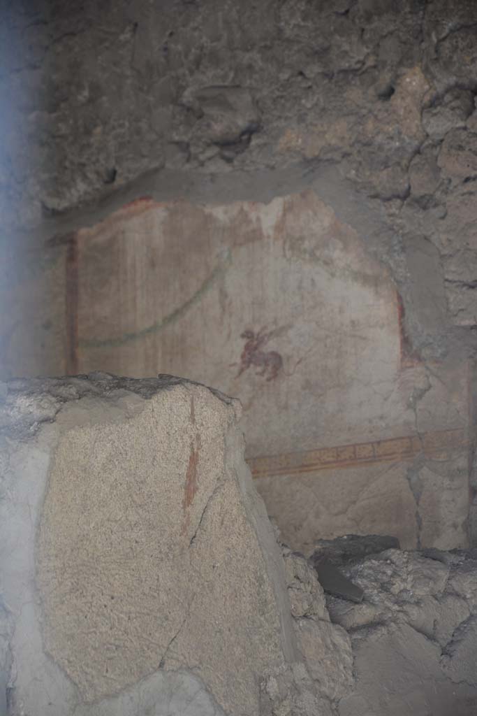 I.10.7 Pompeii. April 2017. Room 2 (taken from entrance doorway). 
Painted plaster with winged beast on west wall. Photo courtesy Adrian Hielscher.
