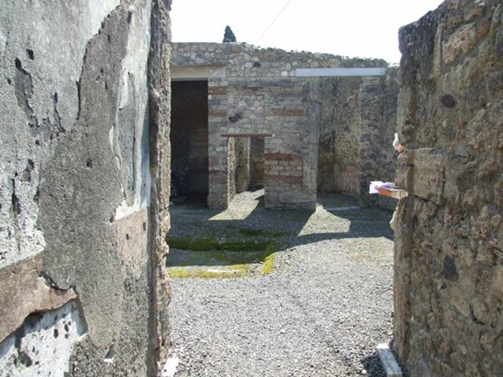 I.10.8 Pompeii.  March 2009.  Looking south along entrance corridor to Room 1. Atrium.