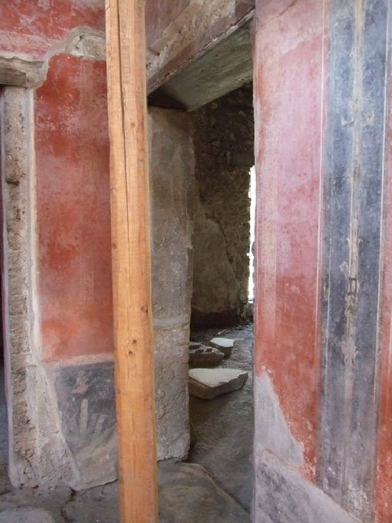 I.10.11 Pompeii. March 2009. 
Room 2, doorway to linked shop at I.10.10 in north wall in north-west corner of atrium.  

