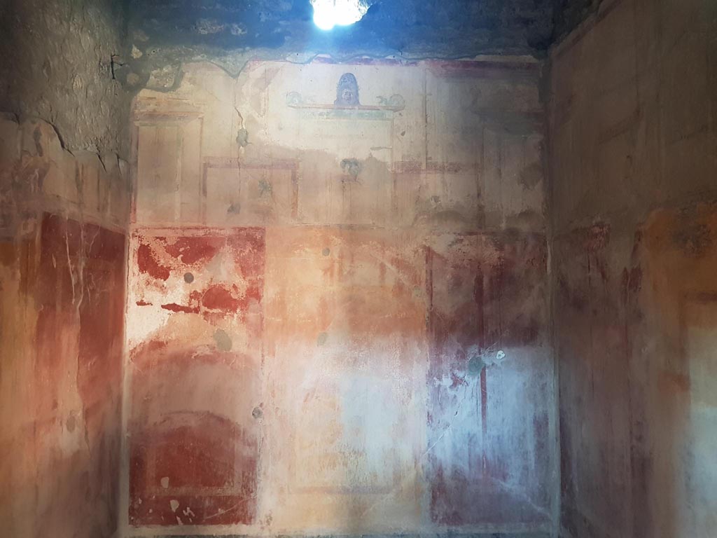 I.10.11 Pompeii. October 2022. Room 9, looking towards upper west wall of cubiculum. Photo courtesy of Klaus Heese.

