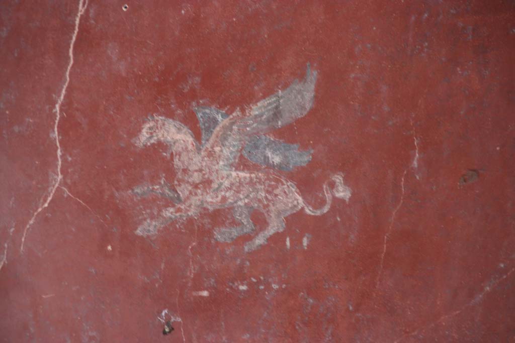 I.10.11 Pompeii. September 2021. 
Room 12, painting of Pegasus from centre of panel at south end of east wall of cubiculum. Photo courtesy of Klaus Heese.

