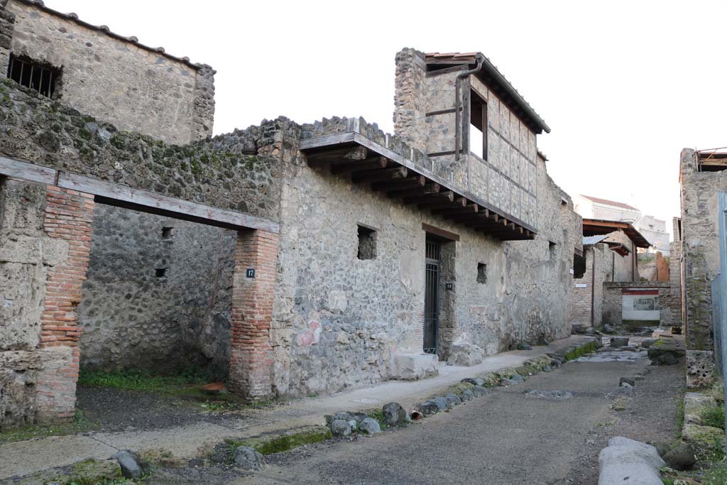 I.10.18 Pompeii, centre right. December 2018. 
Looking north along west side of Vicolo di Paquius Proculus. Photo courtesy of Aude Durand.
