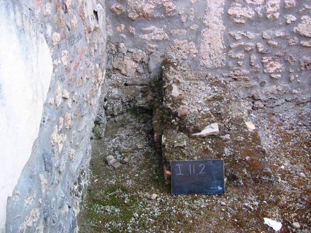 I.11.2 Pompeii. July 2006. Looking west towards a latrine in a room at the rear of the property. Photo courtesy of Barry Hobson.