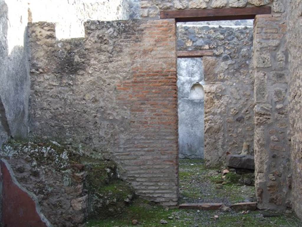 I.11.3 Pompeii. December   2007.   South wall with door to kitchen and rear door leading to garden.
