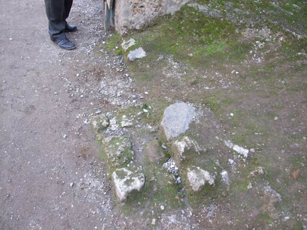 I.11.4 Pompeii. December 2007. Front of shop floor and remains of step?
